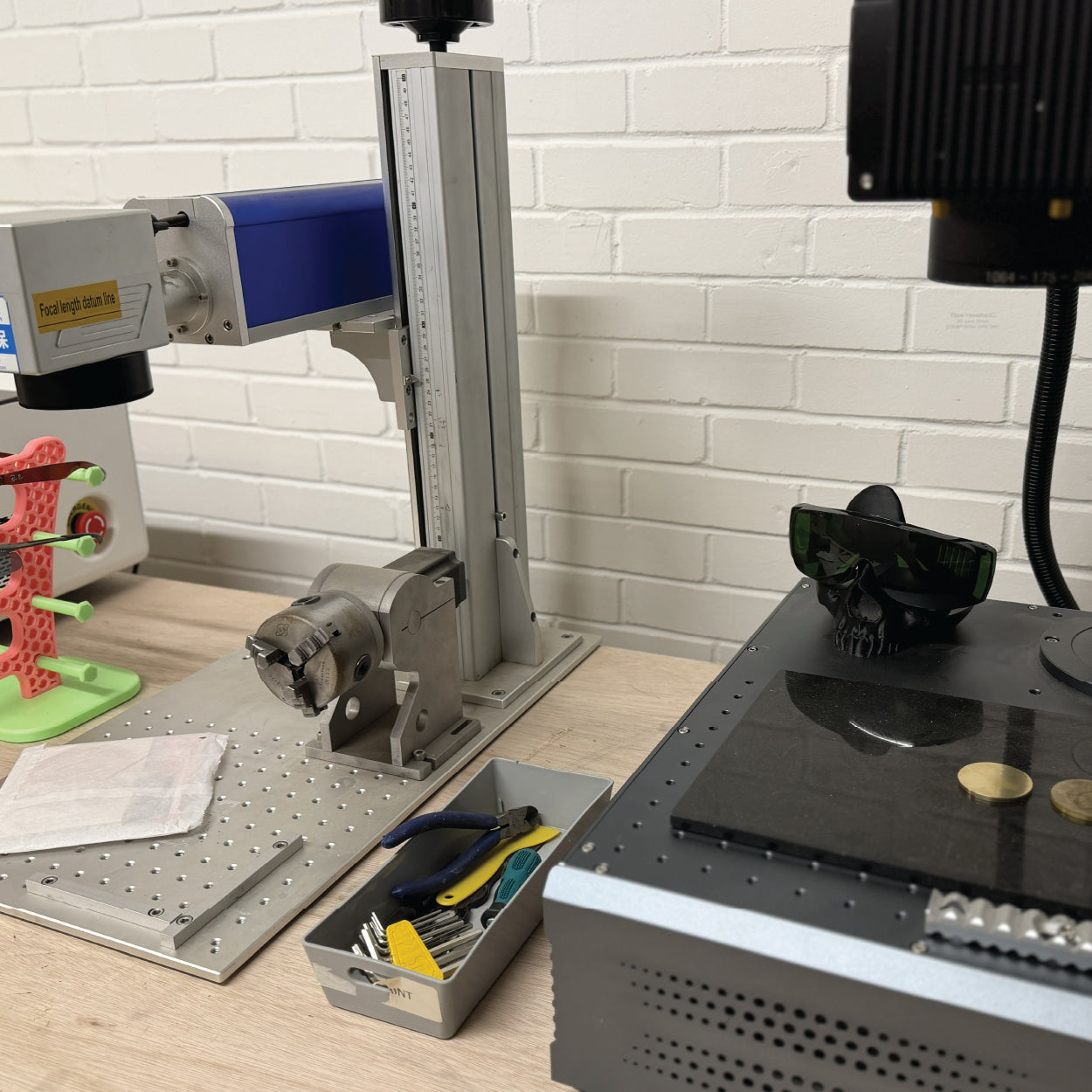 A 100W MOPA Fibre laser engraving a brass insert at Cobblestone Creative