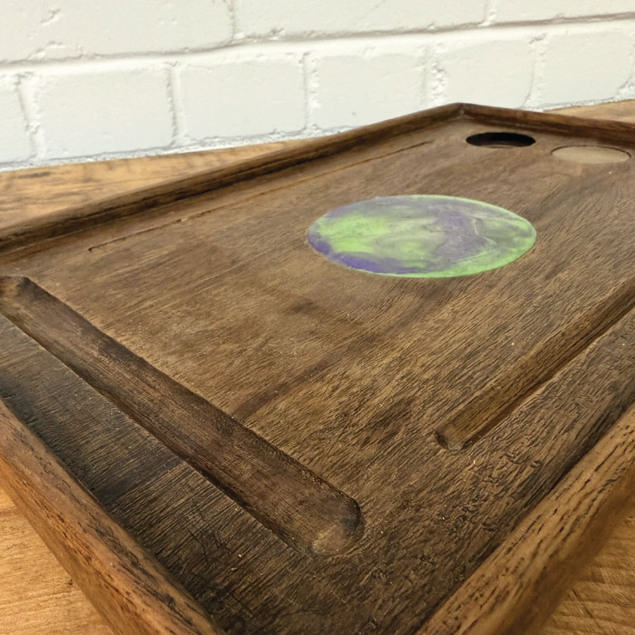 Hardwood tray on a hardwood slab at Cobblestone Creative workshop.