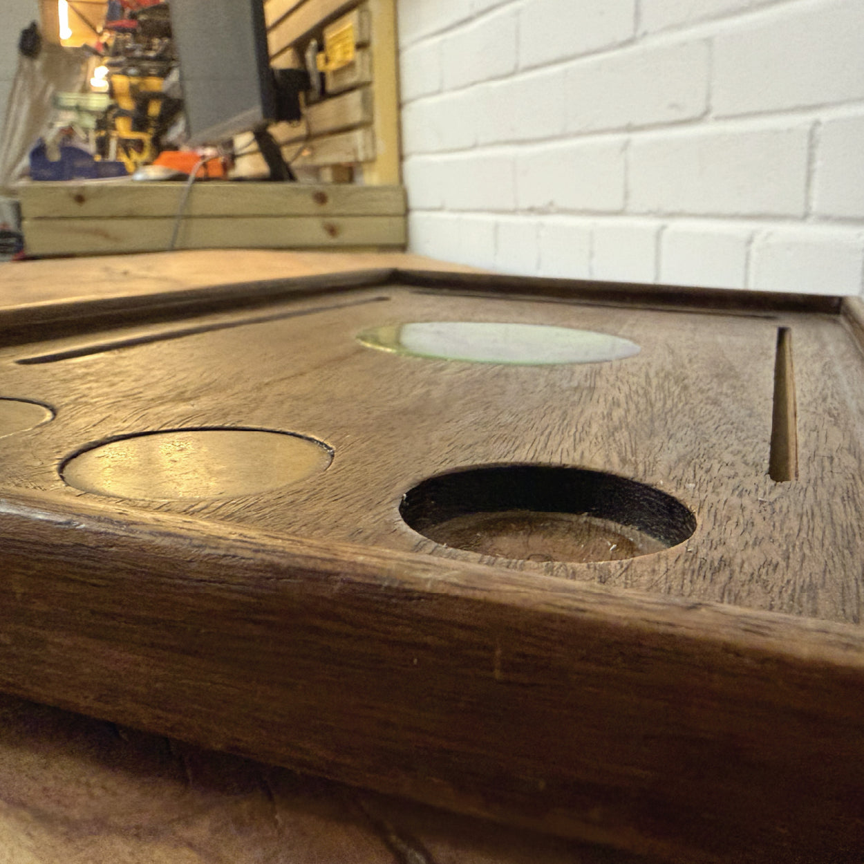 Mahogany tray with brass inserts and a resin centre in Cobblestone Creative warehouse.