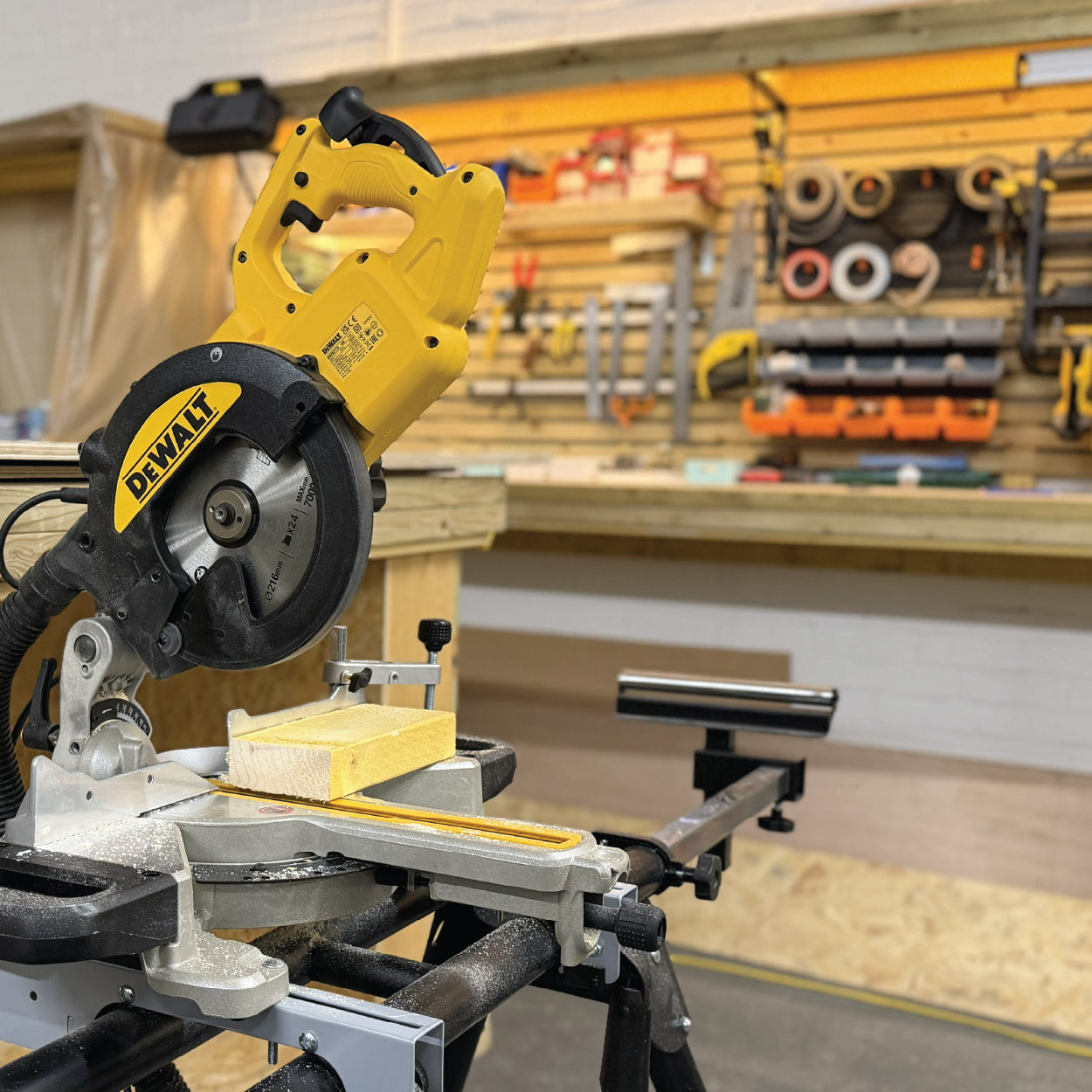 Dewalt chop saw in woodworking workshop at Cobblestone Creative.